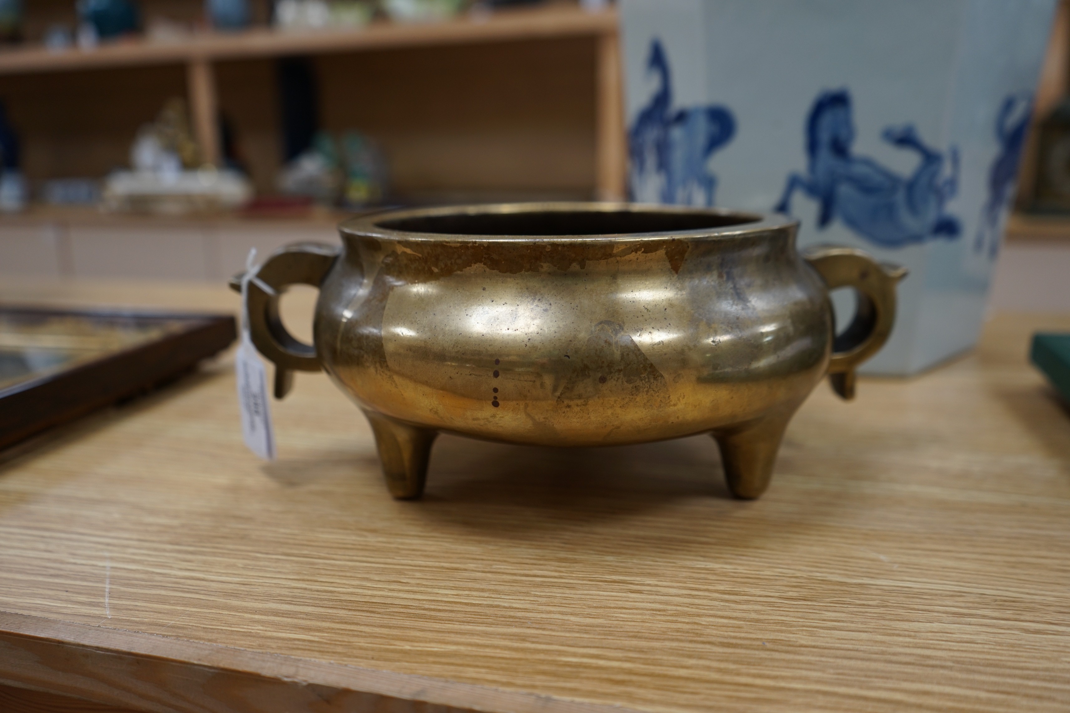 A large Chinese bronze censer, ding, 18th century, with sixteen character Xuande mark, 29cm wide